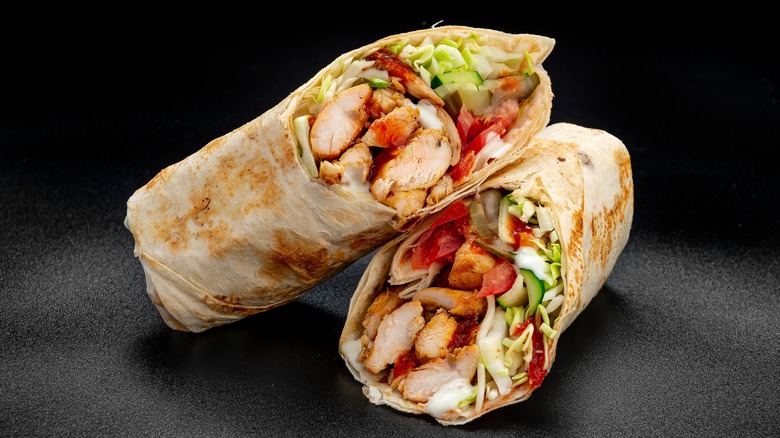chicken salad wrap on black
