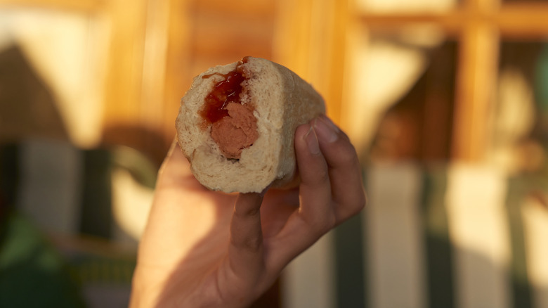 Hot dog topped with ketchup