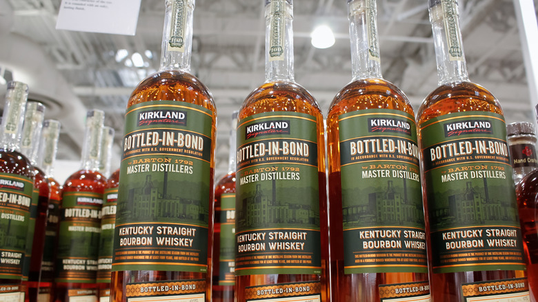 Bottles of Kirkland Signature Bottled-in-Bond Bourbon Whiskey on the store shelf