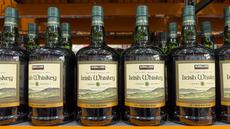Handles of Kirkland Signature Irish Whiskey in stores at Costco.