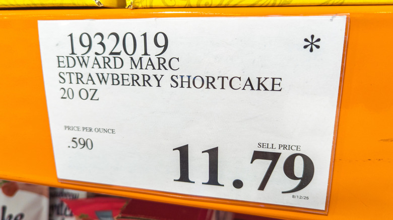 Costco Warehouse price tag signage on product display.