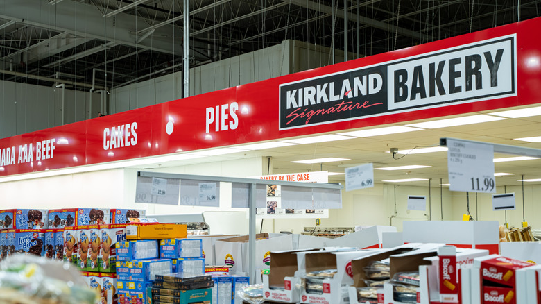 Interior of Costco with its bakery aisle lined with boxes of goods.