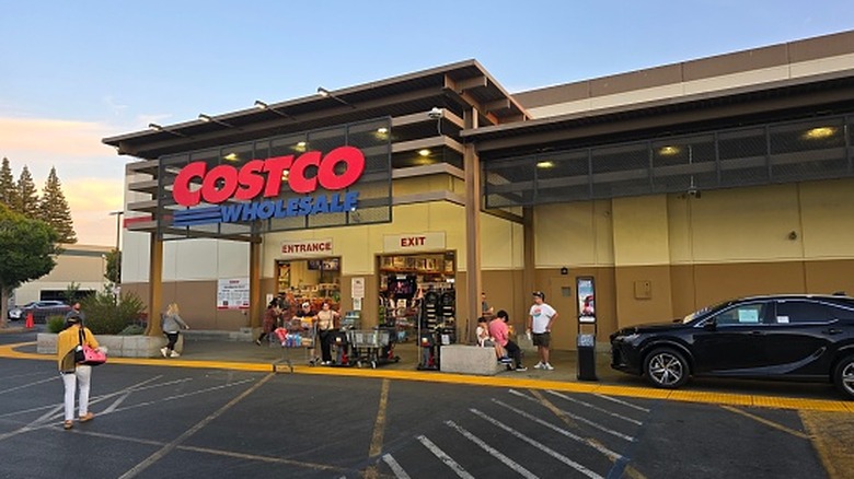 People walking in and out of a Costco Wholesale warehouse in Rancho Cordova