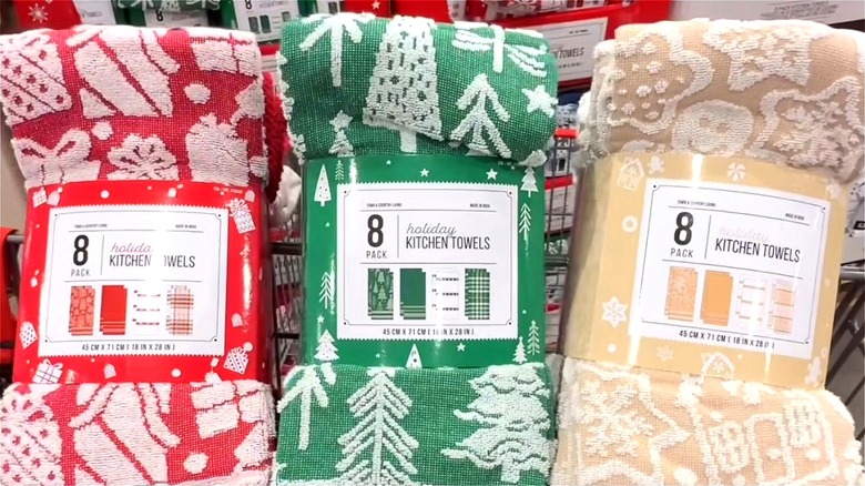 Three packs of Costco's Holiday Kitchen Towels in red, green, and beige.