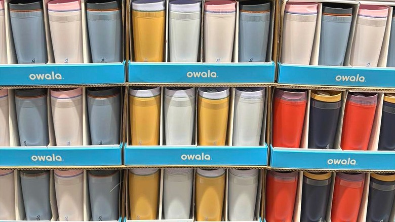 Cases of Owala 2-pack travel mugs in various colors.