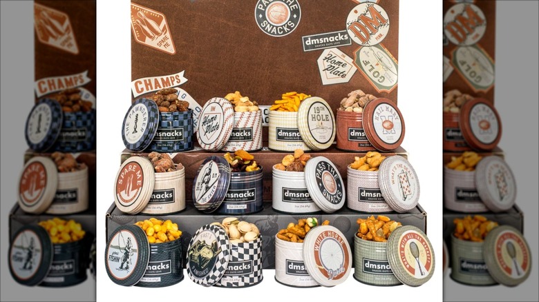 Variety of Damn Man Bar Cart Snacks on display shelf.