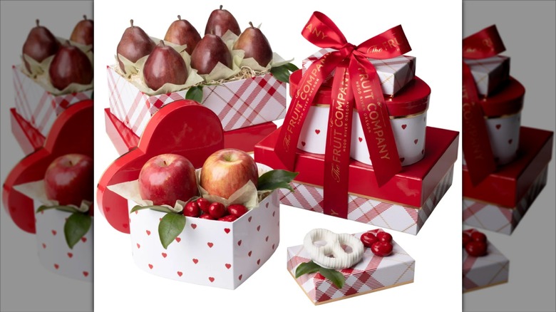 Ribbon-wrapped boxes with fresh fruit.