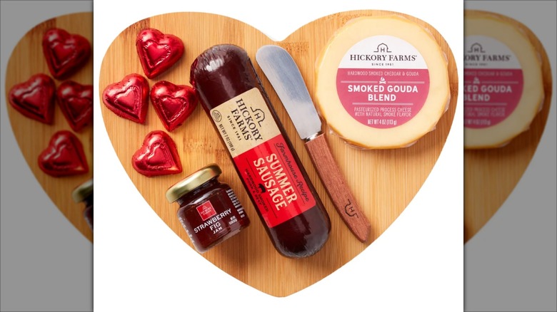 Hickory Farms Charcuterie Board Gift Set with heart shaped wooden board and candy hearts.