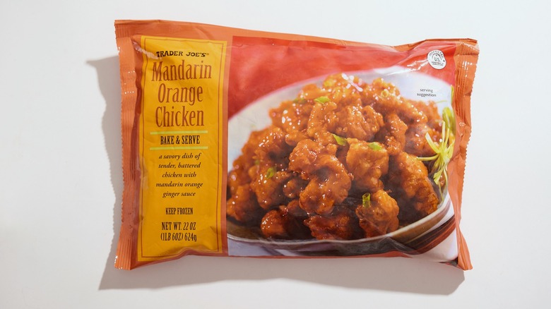 A bag of Trader Joe's orange chicken on a white table