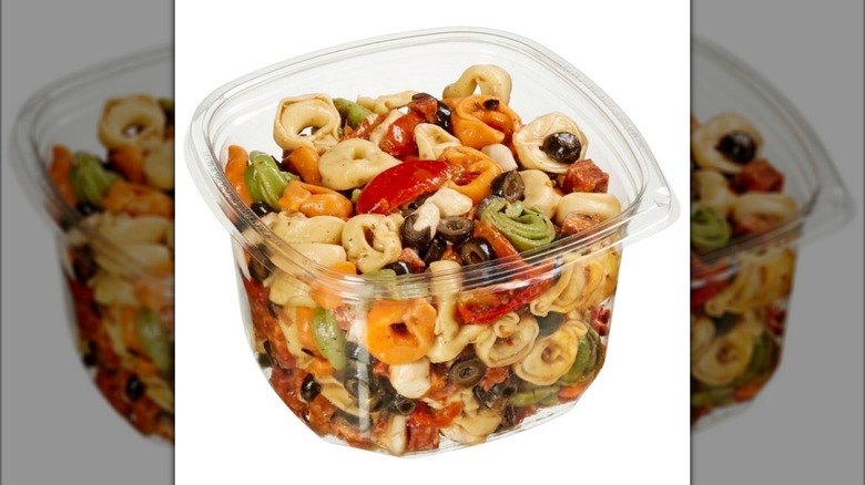 The Kirkland Signature Tortellini Pasta Salad with Mozzarella Pearls and Dressing from Costco on white background