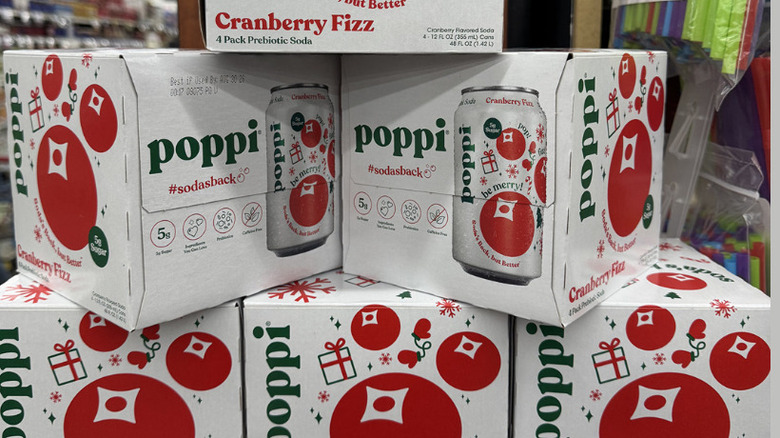 Boxes of Poppi's Cranberry Fizz soda stacked