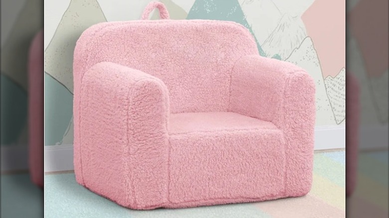 A pink Delta Children Sherpa Cozee Chair