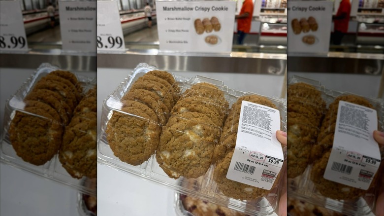 Person holding a plastic container of Costco marshmallow crispy cookies.