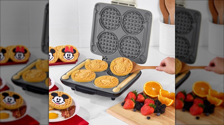 The Dash Disney Mickey & Friends No-Drip Waffle Maker with waffles