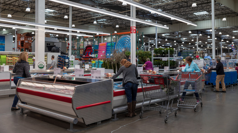 A heavily stocked aisle in a Costco warehouse store