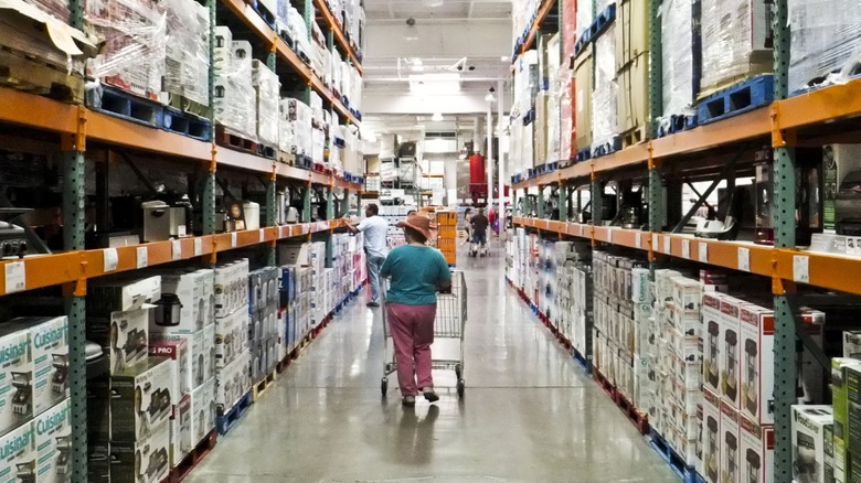 Costco shopper perusing an aisle of kitchen gadgets