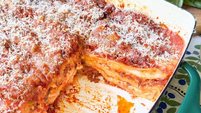 Cut cottage cheese lasagna side view in baking pan