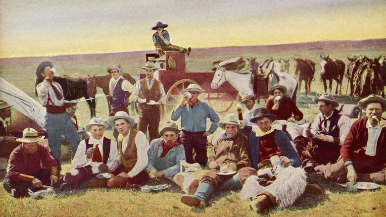 Cowboys eating out on the range