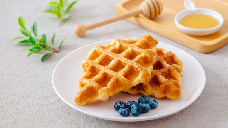 Croffle with blueberries on a plate