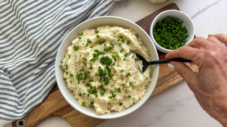 bowl of cauliflower mash topped with chives