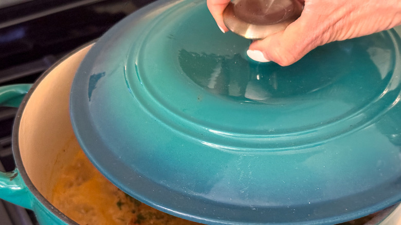 hand covering soup