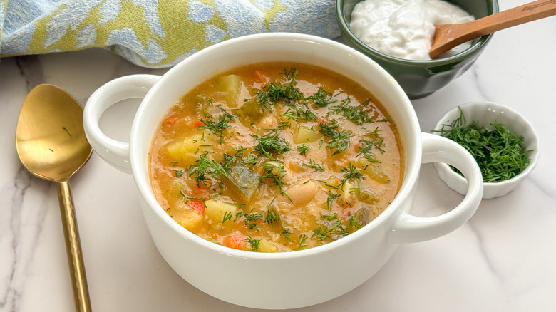 garnished soup in white bowl