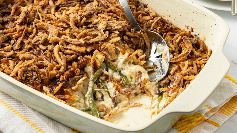 baking dish with spoon of green bean casserole