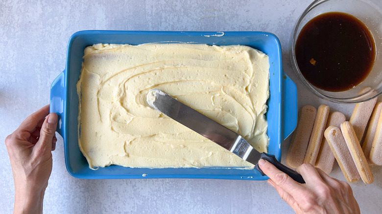 spatula spreading mascarpone in tiramisu