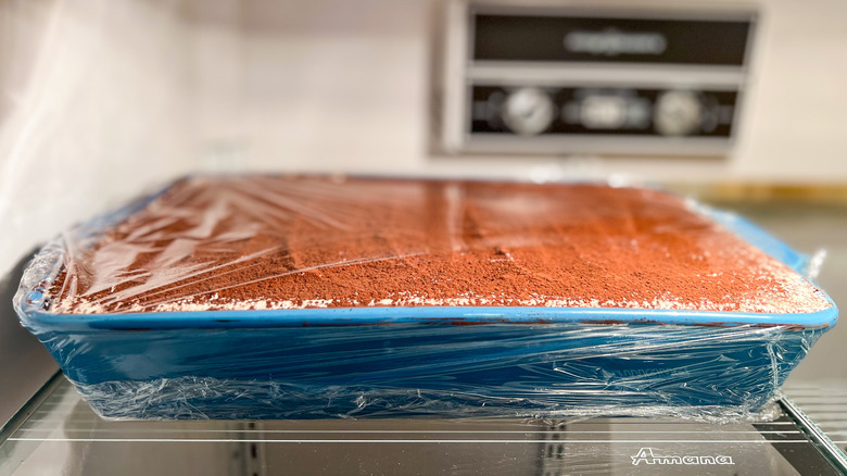 covered hazelnut tiramisu in refrigerator