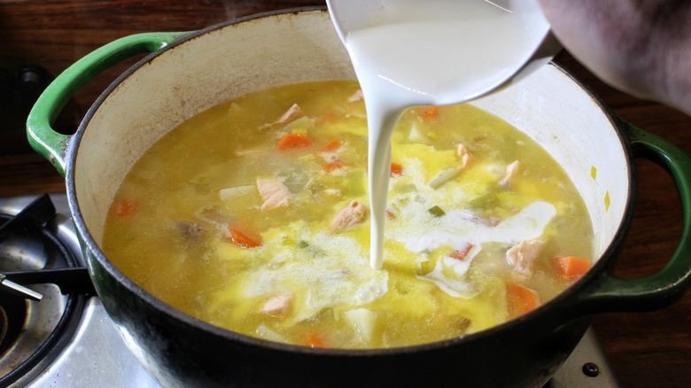 pouring cream into soup
