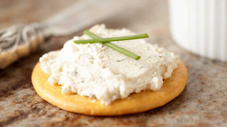 Boursin cheese on a cracker