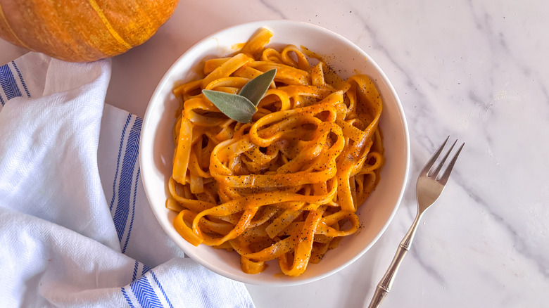 Pumpkin pasta in bowl with sage