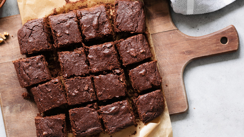 brownies cut into squares on a wooden board