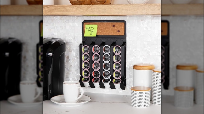 Mind Reader coffee pod organizer on wall with coffee cup