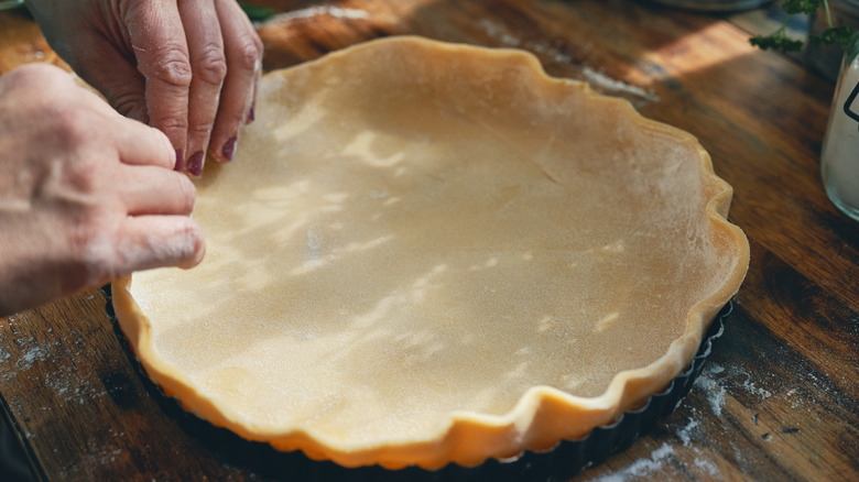 Preparing a pie crust in a dish