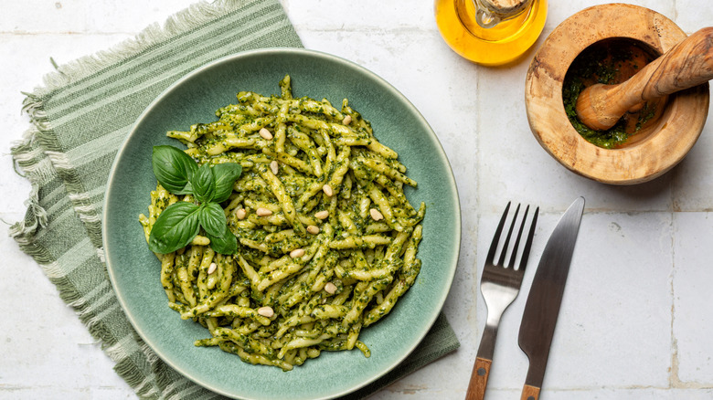 Basil pesto dish in a dish with pine nuts