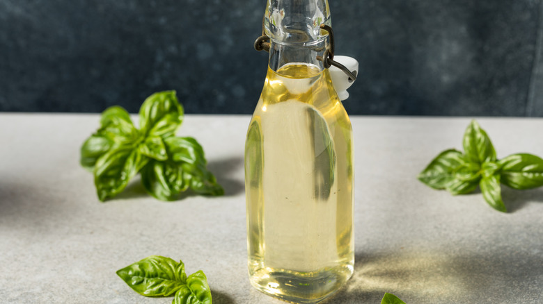 Basil simple syrup with a bottle