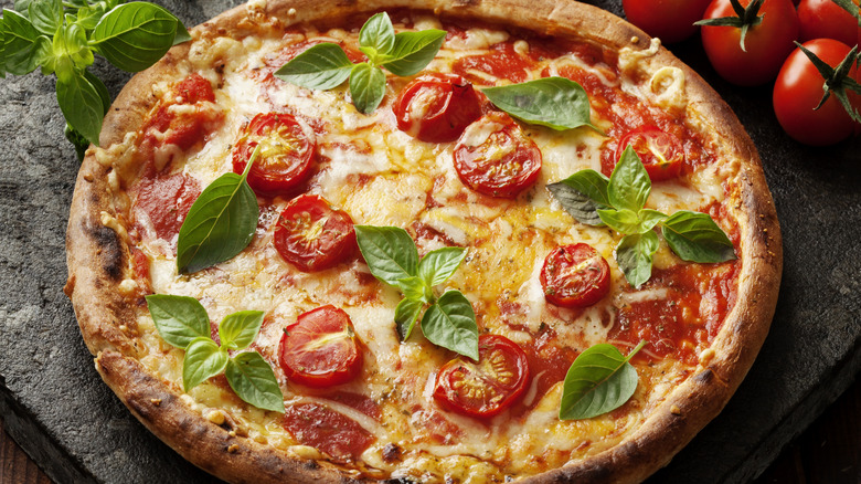 Pizza with tomatoes and basil