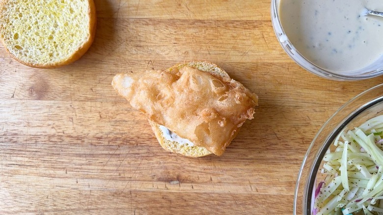 Beer-battered fish filet on bun with tartar sauce