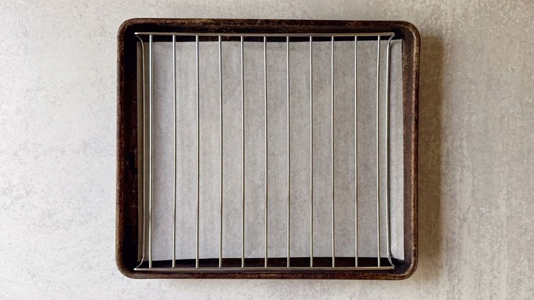Parchment-lined baking sheet with rack