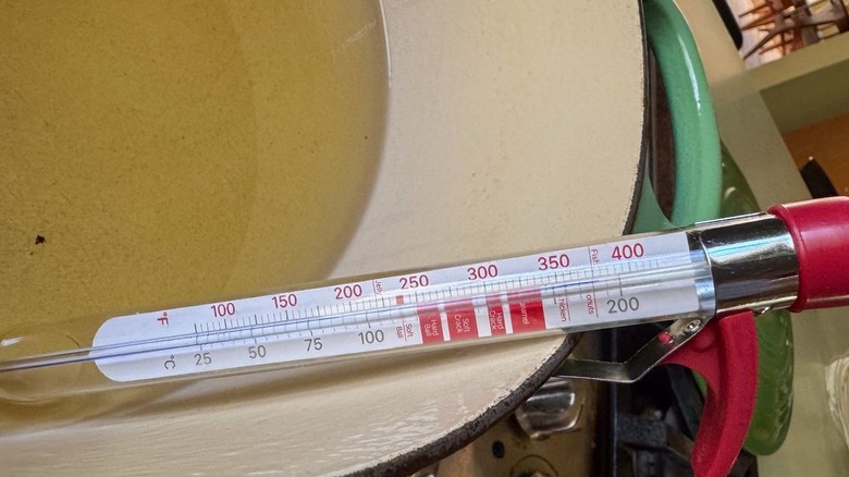 Peanut oil in pot heated to 375 F with thermometer