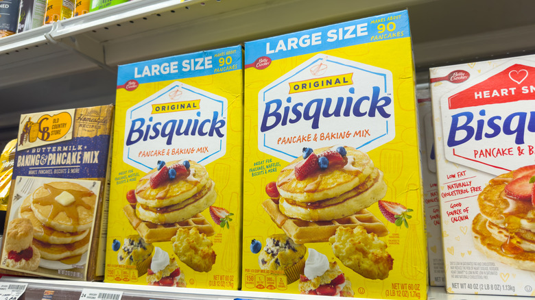 A box of Bisquick mix on a grocery store shelf.