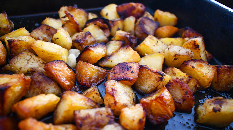 Crispy home fries in a cast iron pan