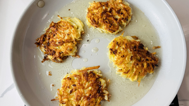 Browned latkes in a skillet