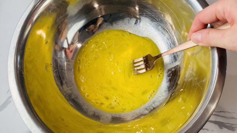 Whisking eggs in bowl