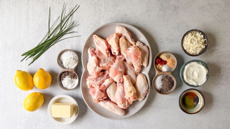 Crispy lemon pepper chicken wings ingredients on countertop
