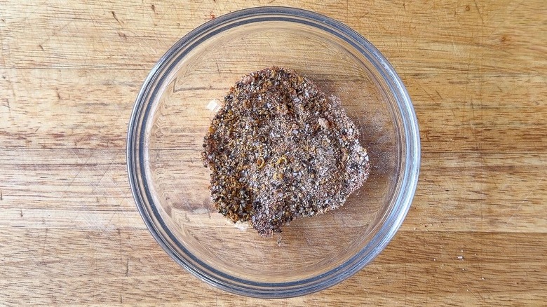 Dry rub for crispy lemon pepper chicken wings in glass bowl