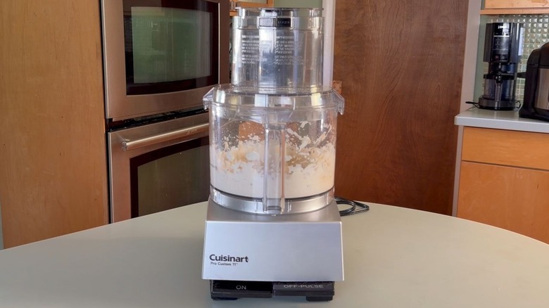 Creamy feta dipping sauce ingredients in food processor bowl