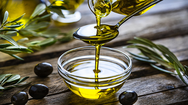 Glass bowl of olive oil