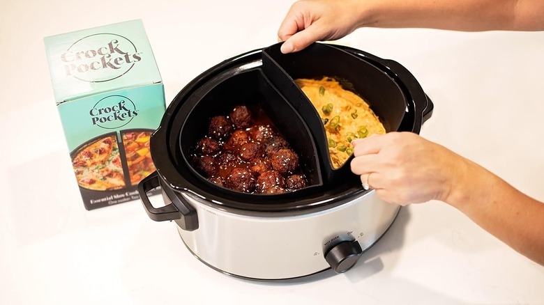 Close up of hands placing a silicone liner inside a Crock-Pot